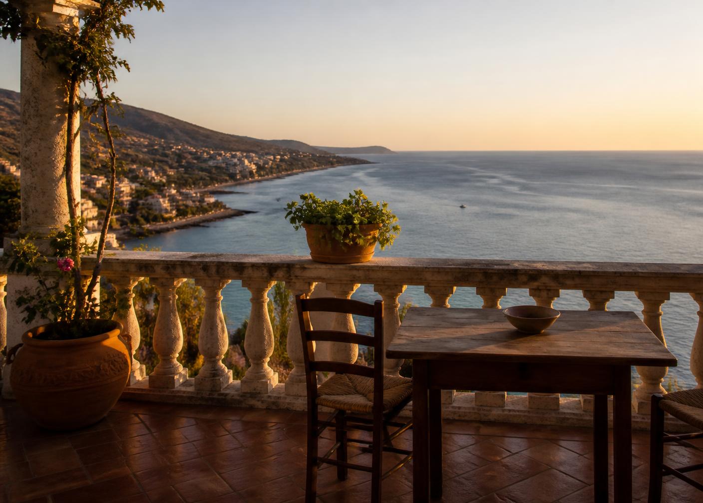 Sea-view terrace of a coastal home in southern Italy at golden hour